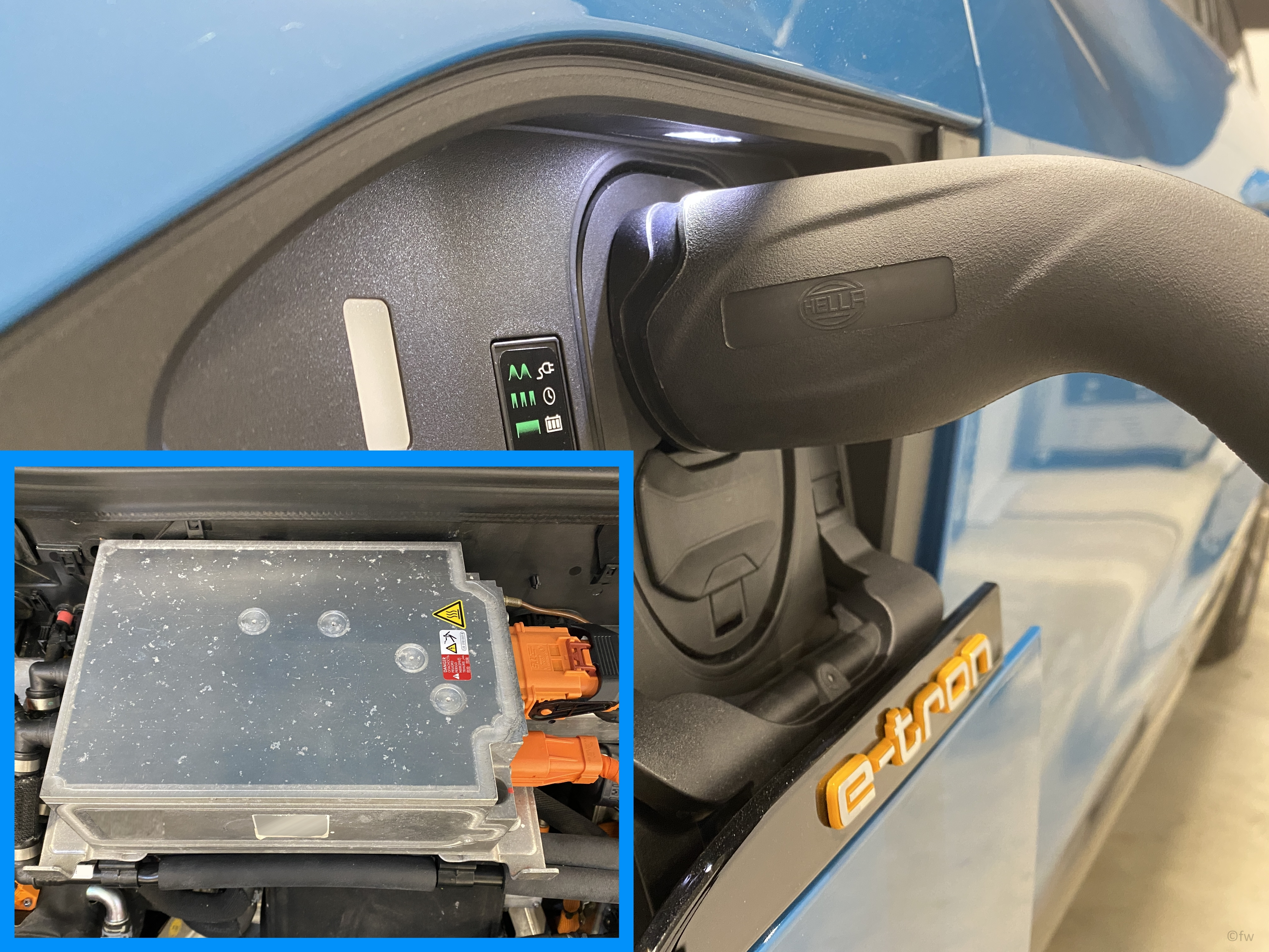 Charging connection of an electric vehicle with connected charging plug and warning lamps, combined with a detailed view of the on-board charger featuring high-voltage connections.